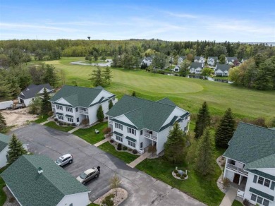 Welcome to this upper-level 2-bedroom, 2-bath condo in the on Charlevoix Golf and Country Club in Michigan - for sale on GolfHomes.com, golf home, golf lot