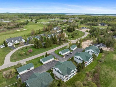 Welcome to this upper-level 2-bedroom, 2-bath condo in the on Charlevoix Golf and Country Club in Michigan - for sale on GolfHomes.com, golf home, golf lot