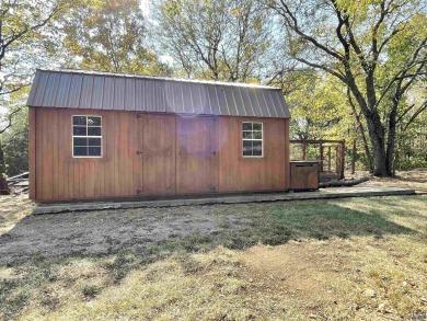 Opportunity awaits! Gorgeous log home living on a quiet street on Lake Perry Country Club in Kansas - for sale on GolfHomes.com, golf home, golf lot