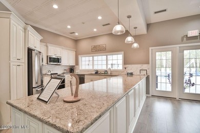 This Champions condo in the vibrant golf community of Sea Trail on Sea Trail Golf Resort in North Carolina - for sale on GolfHomes.com, golf home, golf lot