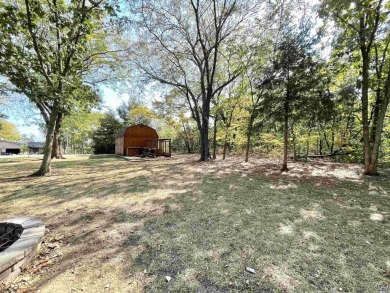 Opportunity awaits! Gorgeous log home living on a quiet street on Lake Perry Country Club in Kansas - for sale on GolfHomes.com, golf home, golf lot