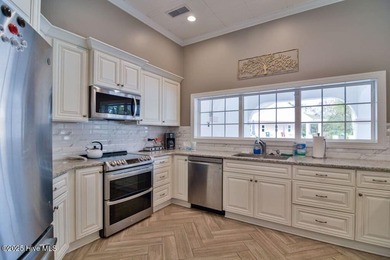 This Champions condo in the vibrant golf community of Sea Trail on Sea Trail Golf Resort in North Carolina - for sale on GolfHomes.com, golf home, golf lot