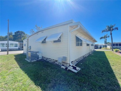 Nestled on a desirable corner lot in the serene back area of the on Fairway Village Golf Course in Florida - for sale on GolfHomes.com, golf home, golf lot