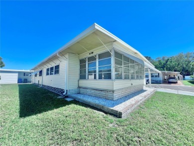 Nestled on a desirable corner lot in the serene back area of the on Fairway Village Golf Course in Florida - for sale on GolfHomes.com, golf home, golf lot