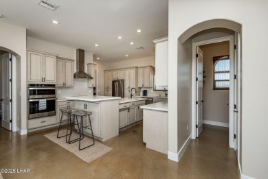 Located at 6322 S Via De Oro, Fort Mohave, Arizona, this on Los Lagos Golf Club in Arizona - for sale on GolfHomes.com, golf home, golf lot