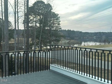 Stunning modern new construction in the gated lake community of on River Golf and Country Club at Lake Royale in North Carolina - for sale on GolfHomes.com, golf home, golf lot