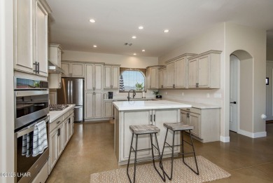 Located at 6322 S Via De Oro, Fort Mohave, Arizona, this on Los Lagos Golf Club in Arizona - for sale on GolfHomes.com, golf home, golf lot