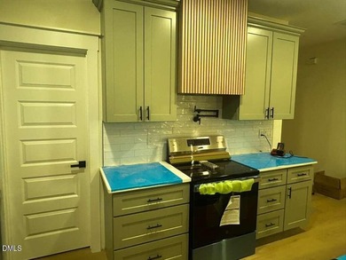 Stunning modern new construction in the gated lake community of on River Golf and Country Club at Lake Royale in North Carolina - for sale on GolfHomes.com, golf home, golf lot