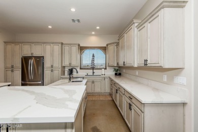 Located at 6322 S Via De Oro, Fort Mohave, Arizona, this on Los Lagos Golf Club in Arizona - for sale on GolfHomes.com, golf home, golf lot