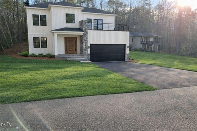 Stunning modern new construction in the gated lake community of on River Golf and Country Club at Lake Royale in North Carolina - for sale on GolfHomes.com, golf home, golf lot