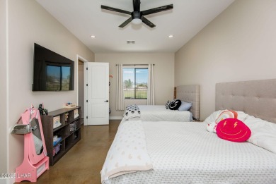 Located at 6322 S Via De Oro, Fort Mohave, Arizona, this on Los Lagos Golf Club in Arizona - for sale on GolfHomes.com, golf home, golf lot