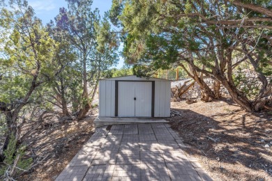 Discover your dream home on nearly an acre of fenced land with on Pueblo de Cochiti Golf Course in New Mexico - for sale on GolfHomes.com, golf home, golf lot