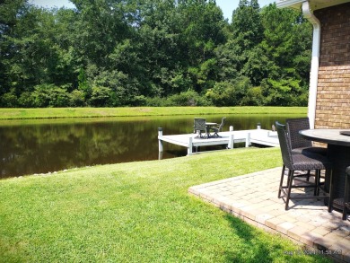 This immaculate home built by Bobby Carter Construction is easy on Players Course At Wyboo Plantation in South Carolina - for sale on GolfHomes.com, golf home, golf lot