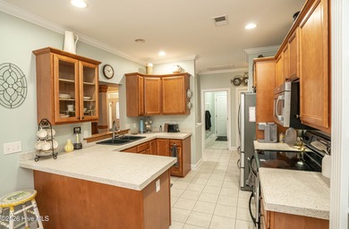 Welcome to this beautifully maintained one-level home located in on Brick Landing Plantation Yacht and Golf Club in North Carolina - for sale on GolfHomes.com, golf home, golf lot