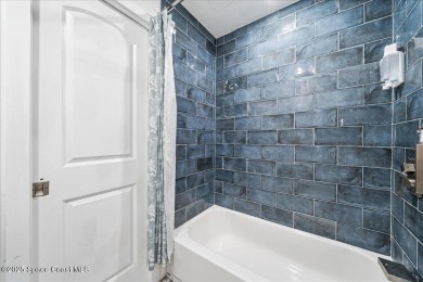 Welcome to this remodeled 4 BEDROOM, 2 BATH one-story home in on Crane Creek Reserve Golf Club in Florida - for sale on GolfHomes.com, golf home, golf lot