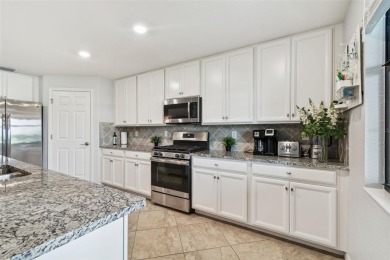 This beautiful end-unit Coach home offers breathtaking views of on Lakewood National Golf Club in Florida - for sale on GolfHomes.com, golf home, golf lot