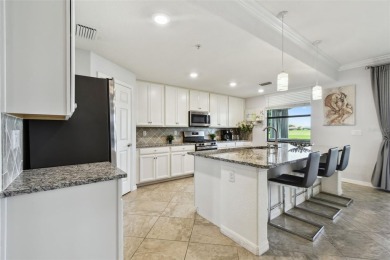 This beautiful end-unit Coach home offers breathtaking views of on Lakewood National Golf Club in Florida - for sale on GolfHomes.com, golf home, golf lot