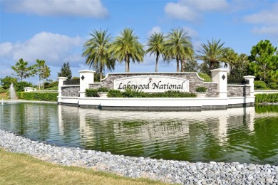 This beautiful end-unit Coach home offers breathtaking views of on Lakewood National Golf Club in Florida - for sale on GolfHomes.com, golf home, golf lot