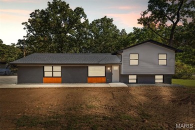 Completely renovated from top to bottom, this 4-bedroom, 3-bath on Terre Du Lac Golf and Country Club in Missouri - for sale on GolfHomes.com, golf home, golf lot