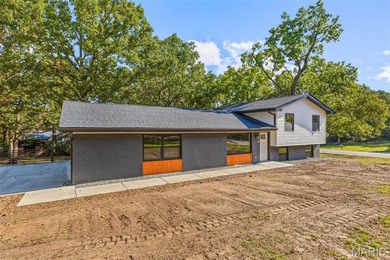 Completely renovated from top to bottom, this 4-bedroom, 3-bath on Terre Du Lac Golf and Country Club in Missouri - for sale on GolfHomes.com, golf home, golf lot