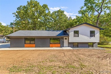 Completely renovated from top to bottom, this 4-bedroom, 3-bath on Terre Du Lac Golf and Country Club in Missouri - for sale on GolfHomes.com, golf home, golf lot