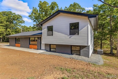 Completely renovated from top to bottom, this 4-bedroom, 3-bath on Terre Du Lac Golf and Country Club in Missouri - for sale on GolfHomes.com, golf home, golf lot