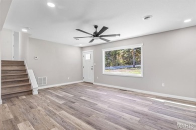 Completely renovated from top to bottom, this 4-bedroom, 3-bath on Terre Du Lac Golf and Country Club in Missouri - for sale on GolfHomes.com, golf home, golf lot