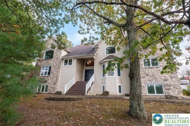Welcome to your ultimate Poconos retreat! This magnificent on Country Club of the Poconos Golf Course in Pennsylvania - for sale on GolfHomes.com, golf home, golf lot