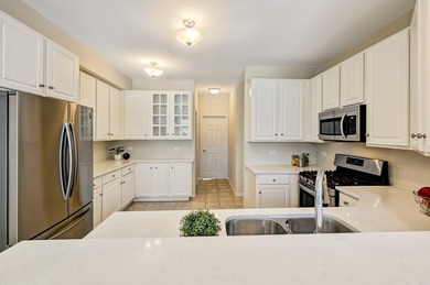 Nestled within the Fairway Club, this exceptional end unit on Edgewood Valley Country Club in Illinois - for sale on GolfHomes.com, golf home, golf lot