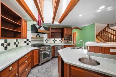 Perched at the crest of a wooded hill, this distinctive on Birchwood Farms Golf and Country Club in Michigan - for sale on GolfHomes.com, golf home, golf lot