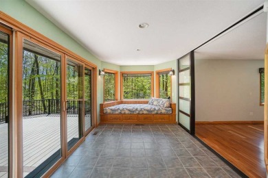 Perched at the crest of a wooded hill, this distinctive on Birchwood Farms Golf and Country Club in Michigan - for sale on GolfHomes.com, golf home, golf lot