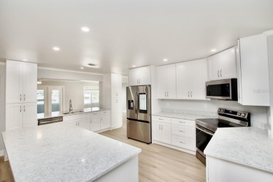 One or more photo(s) has been virtually staged. NO SHOES....NO on Gulf Harbors Golf Course in Florida - for sale on GolfHomes.com, golf home, golf lot