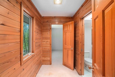 Perched at the crest of a wooded hill, this distinctive on Birchwood Farms Golf and Country Club in Michigan - for sale on GolfHomes.com, golf home, golf lot