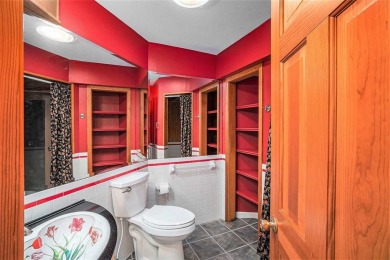 Perched at the crest of a wooded hill, this distinctive on Birchwood Farms Golf and Country Club in Michigan - for sale on GolfHomes.com, golf home, golf lot