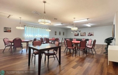 This charming 2-bedroom, 2-bathroom corner condo is in the on Oriole Golf and Tennis Club in Florida - for sale on GolfHomes.com, golf home, golf lot