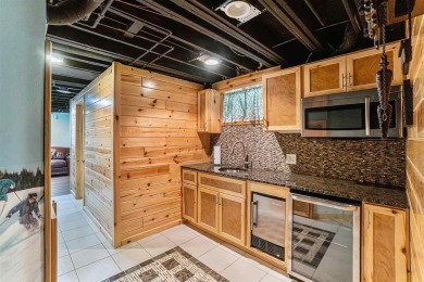 Perched at the crest of a wooded hill, this distinctive on Birchwood Farms Golf and Country Club in Michigan - for sale on GolfHomes.com, golf home, golf lot