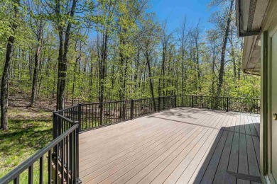 Perched at the crest of a wooded hill, this distinctive on Birchwood Farms Golf and Country Club in Michigan - for sale on GolfHomes.com, golf home, golf lot