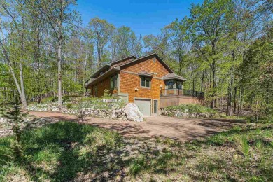 Perched at the crest of a wooded hill, this distinctive on Birchwood Farms Golf and Country Club in Michigan - for sale on GolfHomes.com, golf home, golf lot