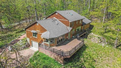 Perched at the crest of a wooded hill, this distinctive on Birchwood Farms Golf and Country Club in Michigan - for sale on GolfHomes.com, golf home, golf lot
