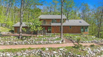 Perched at the crest of a wooded hill, this distinctive on Birchwood Farms Golf and Country Club in Michigan - for sale on GolfHomes.com, golf home, golf lot
