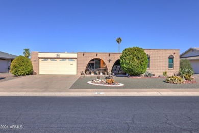 This Sun City home is delightful! Its spacious layout and large on PalmBrook Country Club in Arizona - for sale on GolfHomes.com, golf home, golf lot