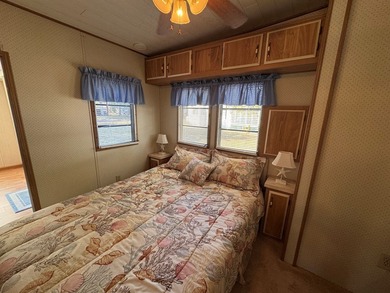 Oversized lot with park trailer, septic, room addition, deck on Captains Cove Golf and Yacht Club in Virginia - for sale on GolfHomes.com, golf home, golf lot