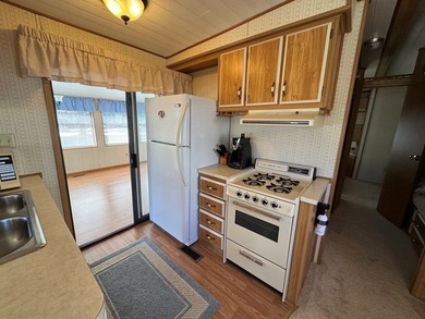 Oversized lot with park trailer, septic, room addition, deck on Captains Cove Golf and Yacht Club in Virginia - for sale on GolfHomes.com, golf home, golf lot