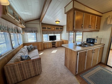 Oversized lot with park trailer, septic, room addition, deck on Captains Cove Golf and Yacht Club in Virginia - for sale on GolfHomes.com, golf home, golf lot