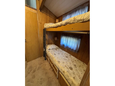 Oversized lot with park trailer, septic, room addition, deck on Captains Cove Golf and Yacht Club in Virginia - for sale on GolfHomes.com, golf home, golf lot