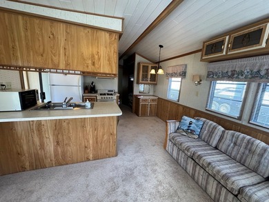 Oversized lot with park trailer, septic, room addition, deck on Captains Cove Golf and Yacht Club in Virginia - for sale on GolfHomes.com, golf home, golf lot