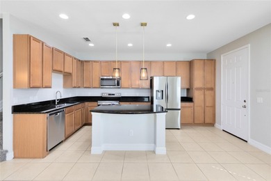 Welcome to this spacious end-unit townhome in the guard-gated on Eagle Creek Golf Club in Florida - for sale on GolfHomes.com, golf home, golf lot