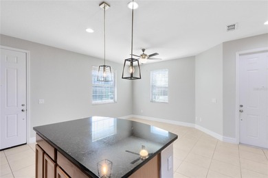 Welcome to this spacious end-unit townhome in the guard-gated on Eagle Creek Golf Club in Florida - for sale on GolfHomes.com, golf home, golf lot
