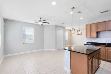 Welcome to this spacious end-unit townhome in the guard-gated on Eagle Creek Golf Club in Florida - for sale on GolfHomes.com, golf home, golf lot