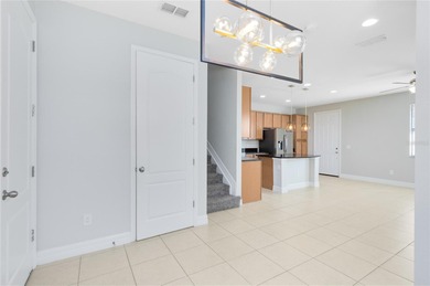 Welcome to this spacious end-unit townhome in the guard-gated on Eagle Creek Golf Club in Florida - for sale on GolfHomes.com, golf home, golf lot